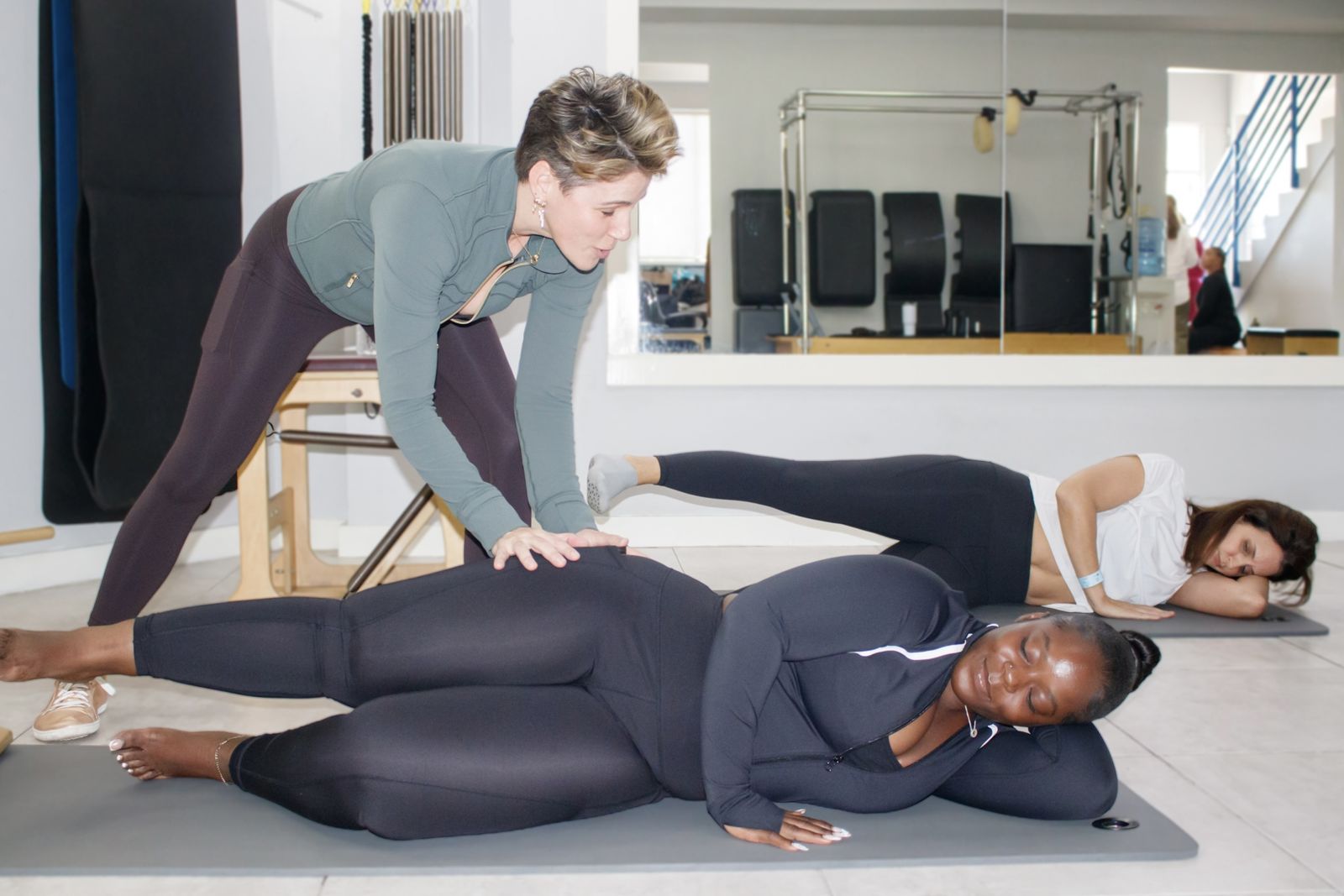 Pilates teacher coaching a student at Body Forte